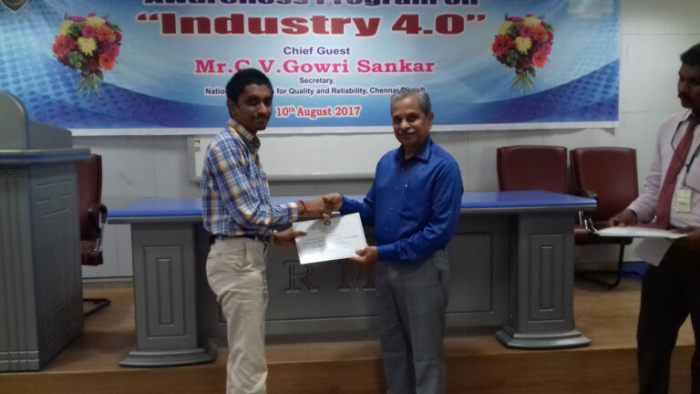 Mr.C V Gowi Sankar presenting the certificate